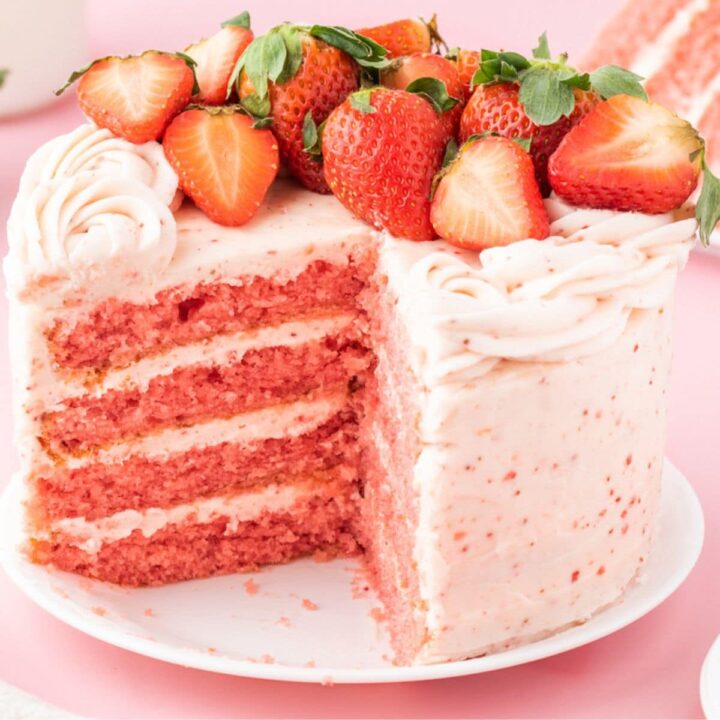 delicious pink cake topped with strawberries