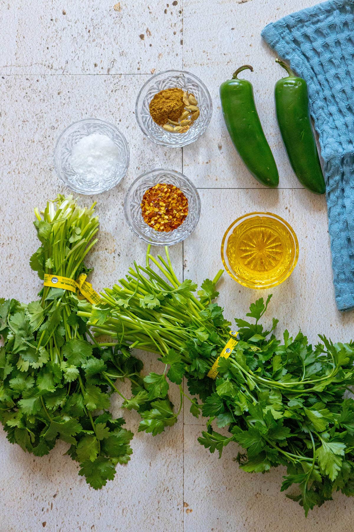 The ingredients for a recipe for chile relleno with cilantro zhoug sauce.