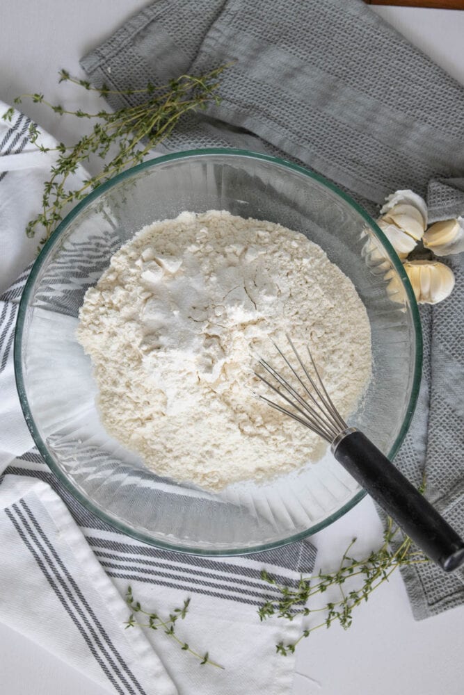 salt and flour whisking in a bowl