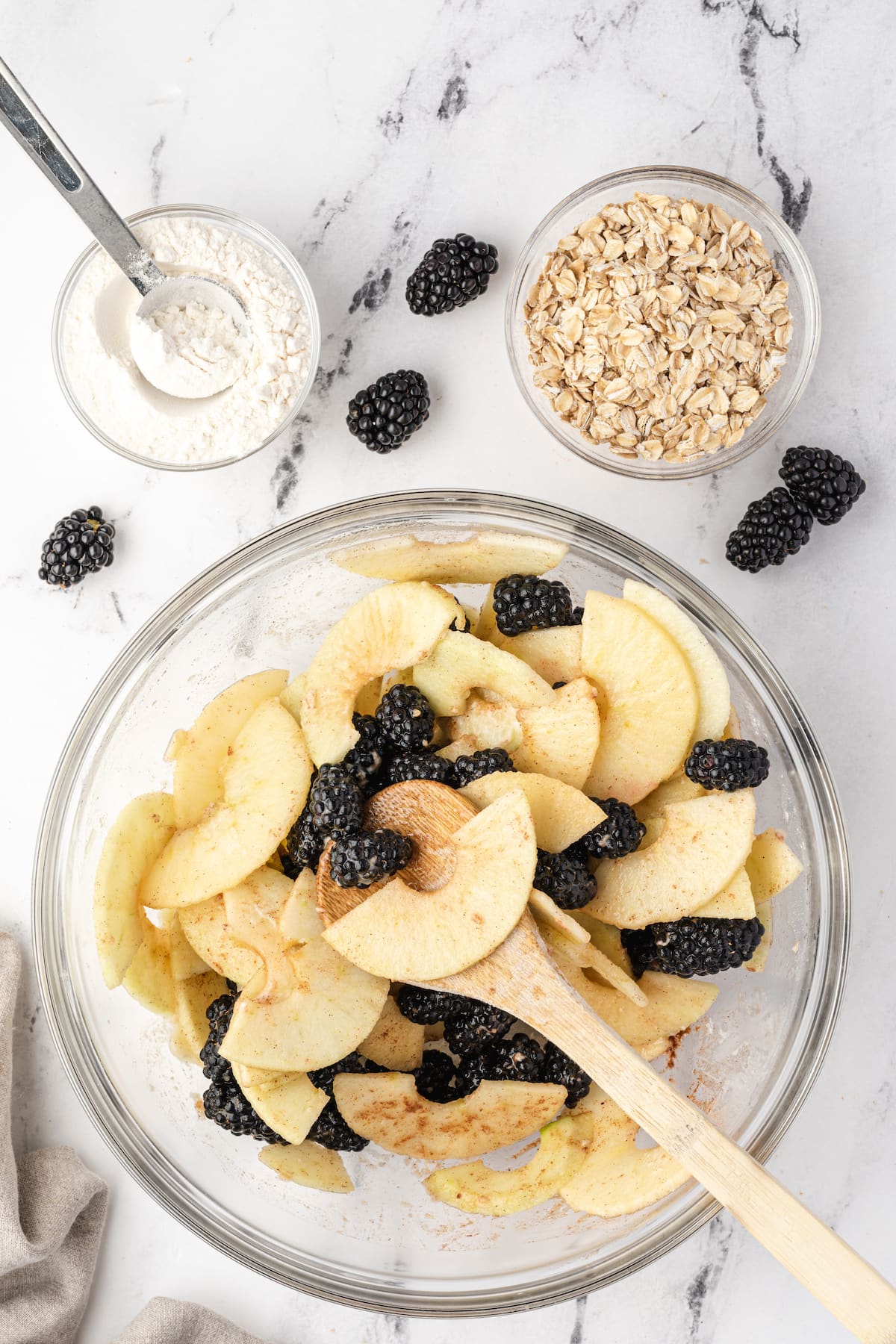 A bowl of oatmeal with blackberries.
