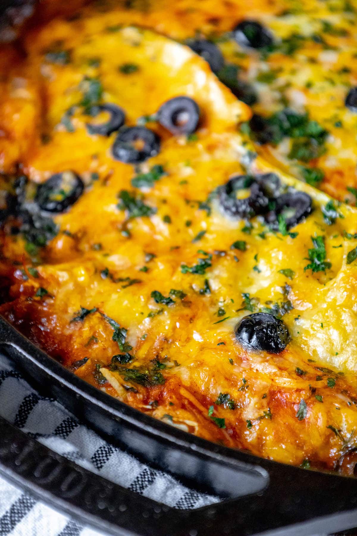 chicken enchilada skillet in a cast iron pan on a table