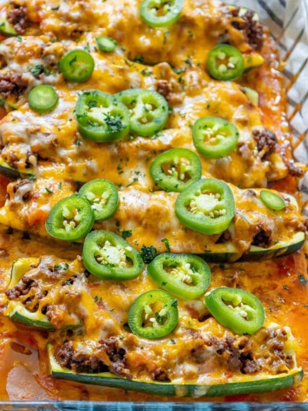 zucchini boats stuffed with taco meat and cheese with jalapenos on top