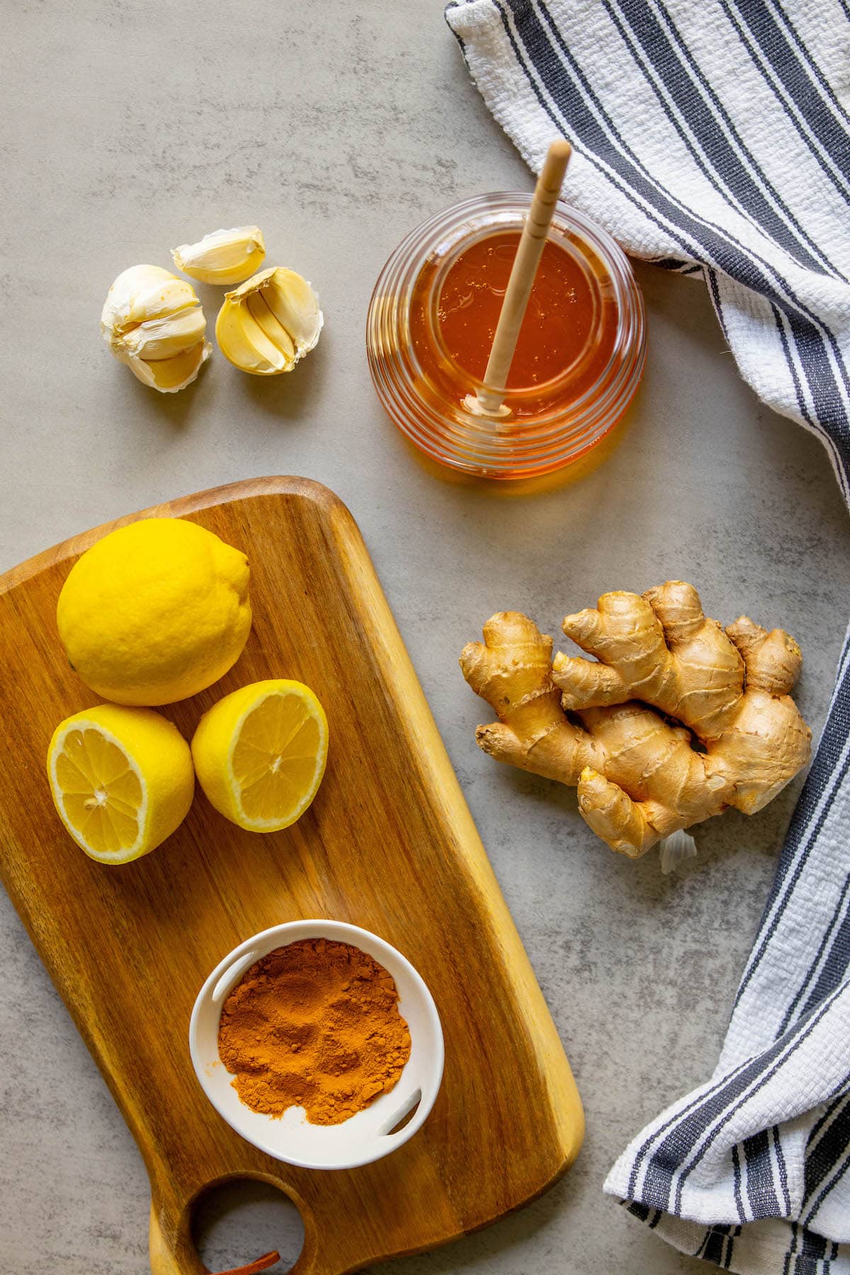 lemon, garlic, turmeric, honey on a table