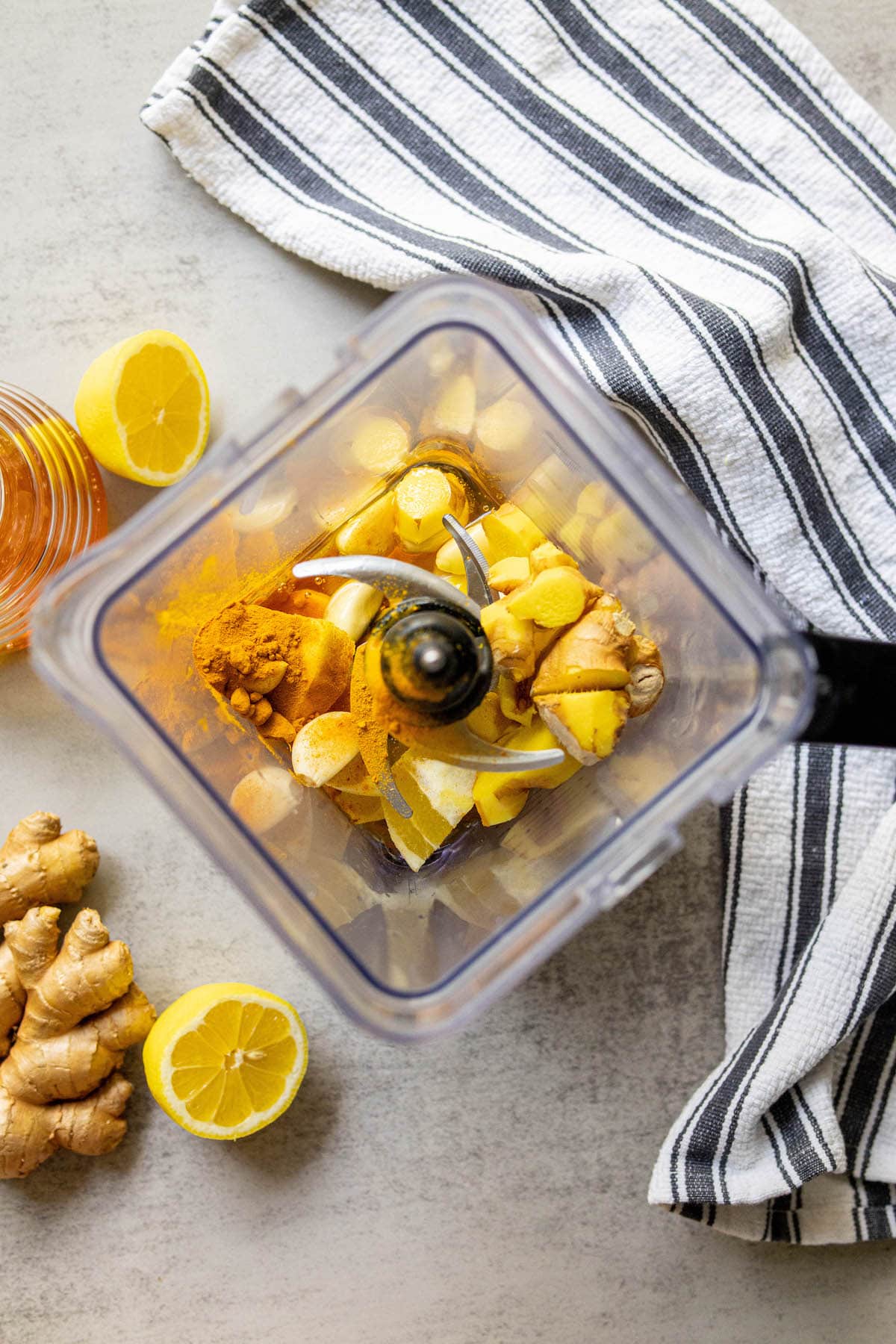 garlic, ginger, lemon, turmeric in a blender