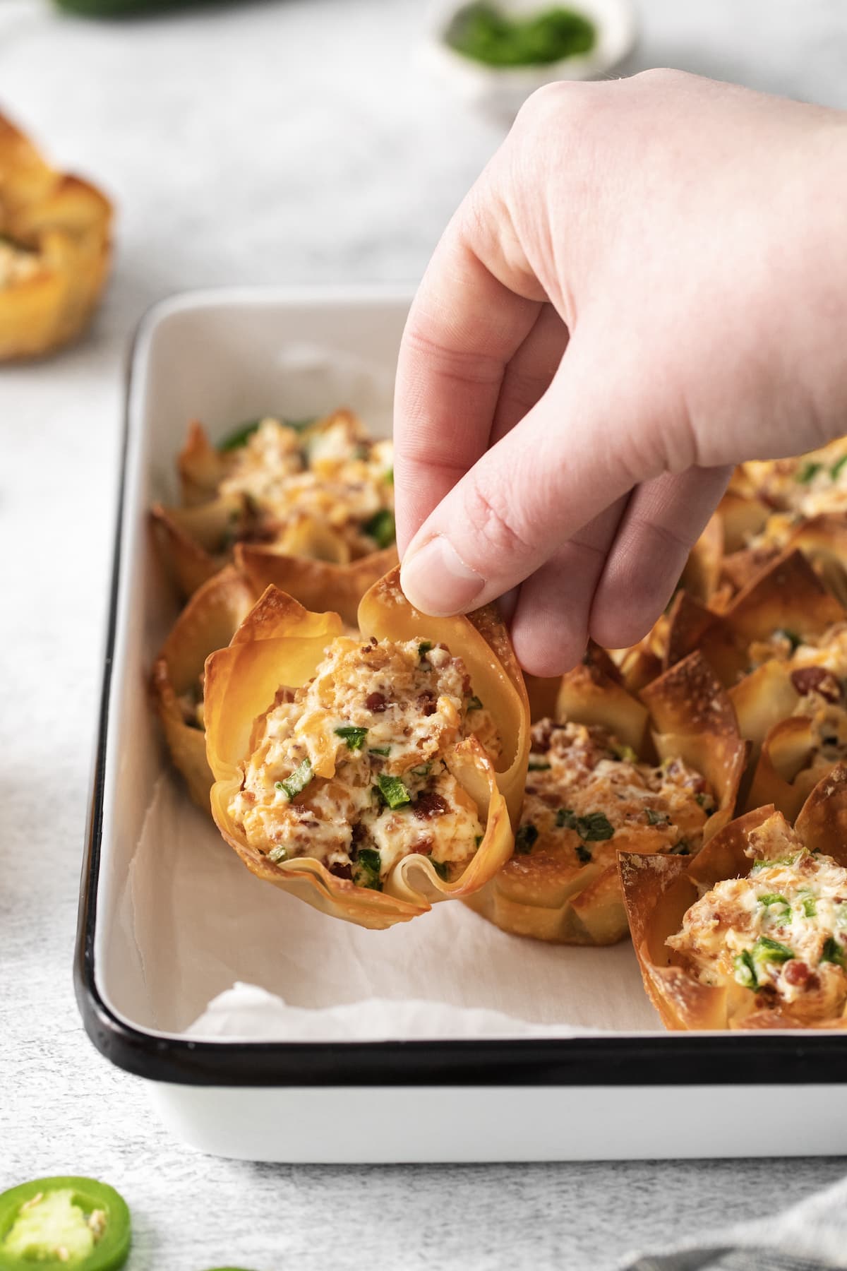 toasted phyllo cup with creamy jalapeno popper mix baked in it