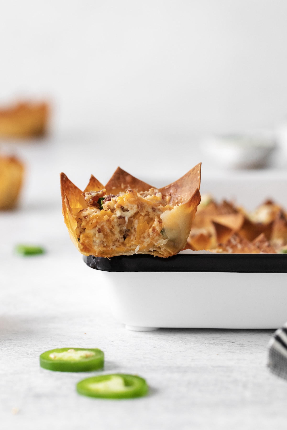 toasted phyllo cup with creamy jalapeno popper mix baked in it