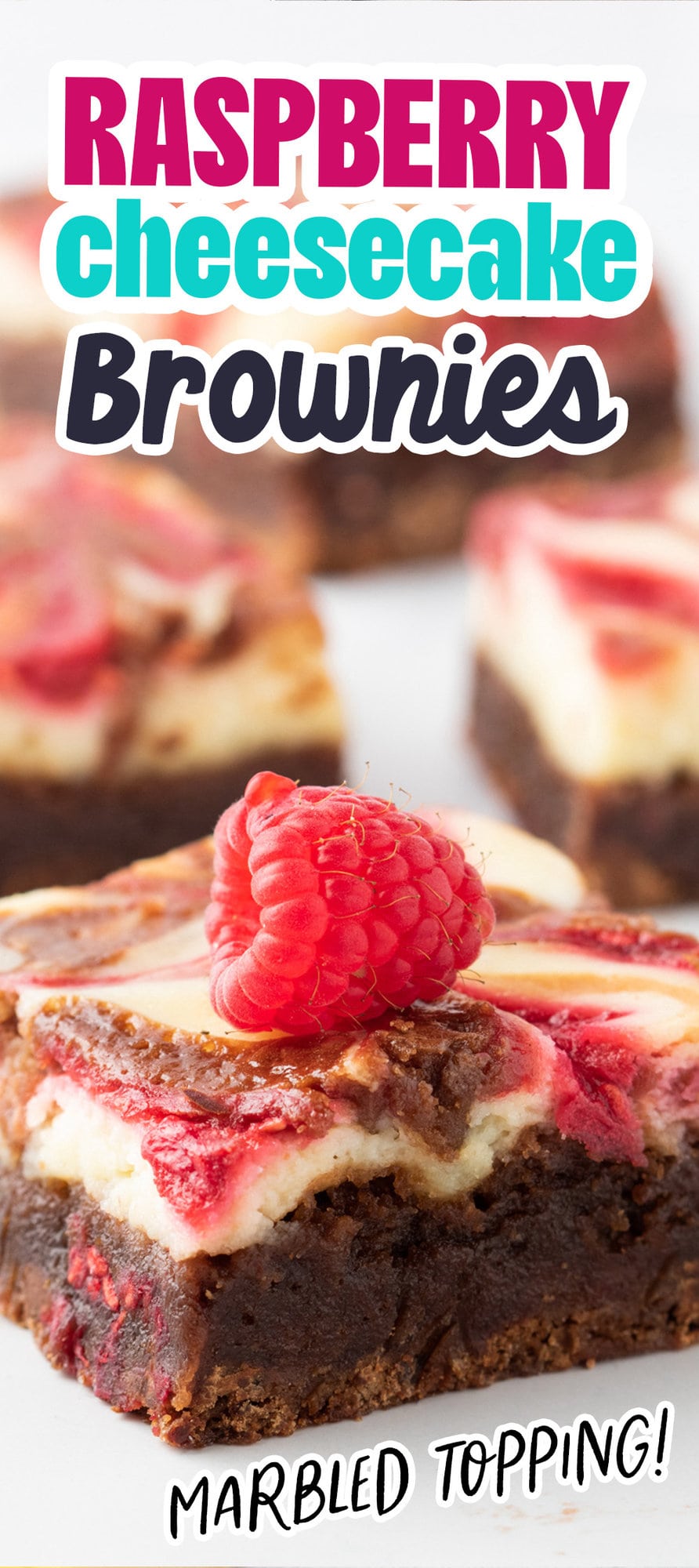 cheesecake marbled brownie bar with raspberry sauce on top