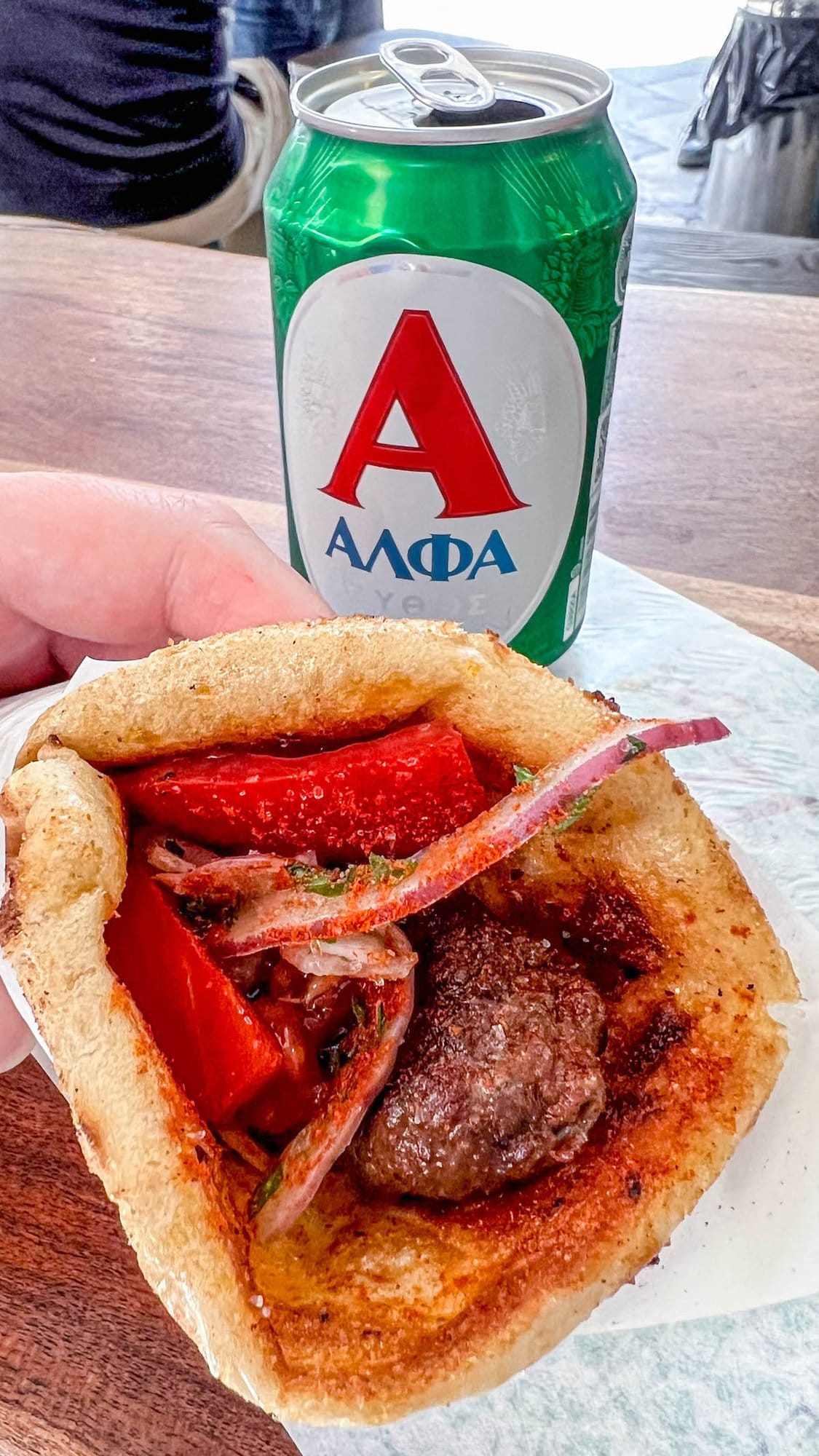 A charming Greek village street, evoking the rustic culinary heritage.