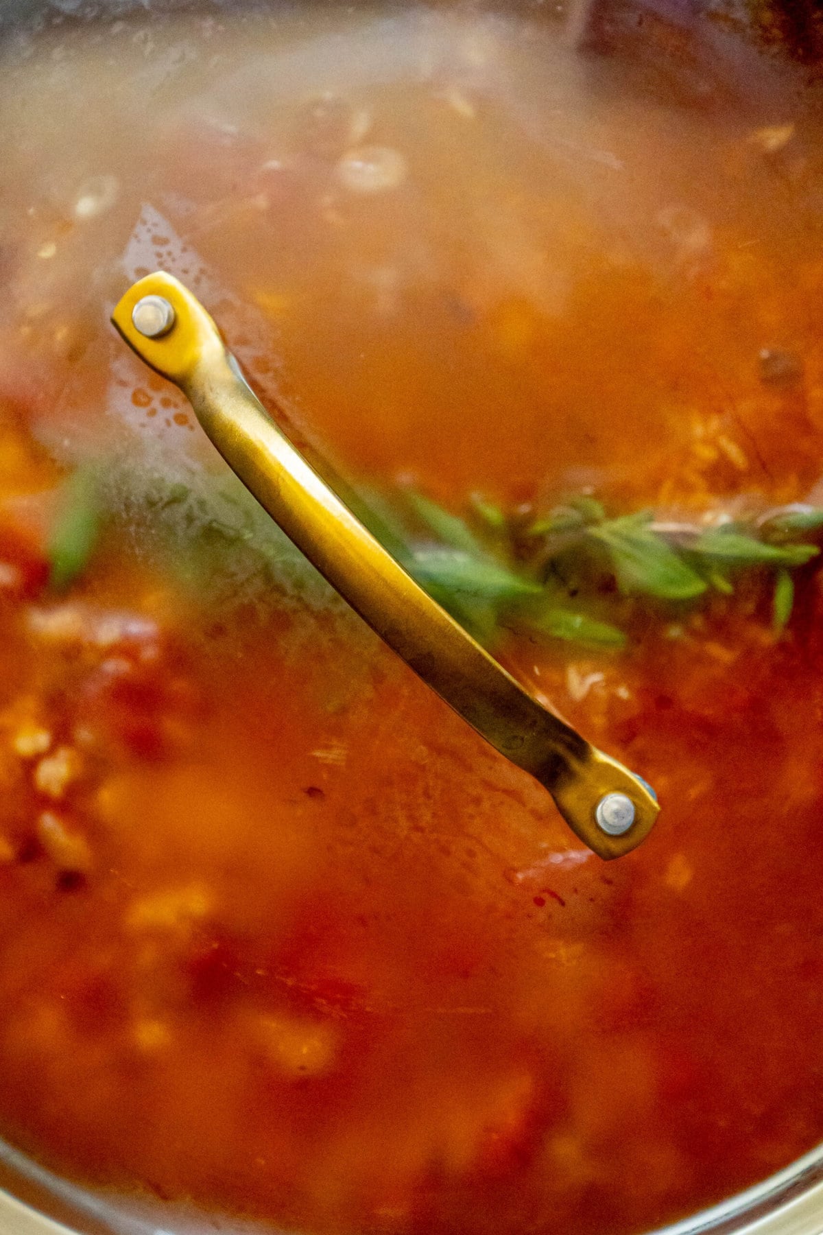 mexican rice cooking in a pan with the lid on