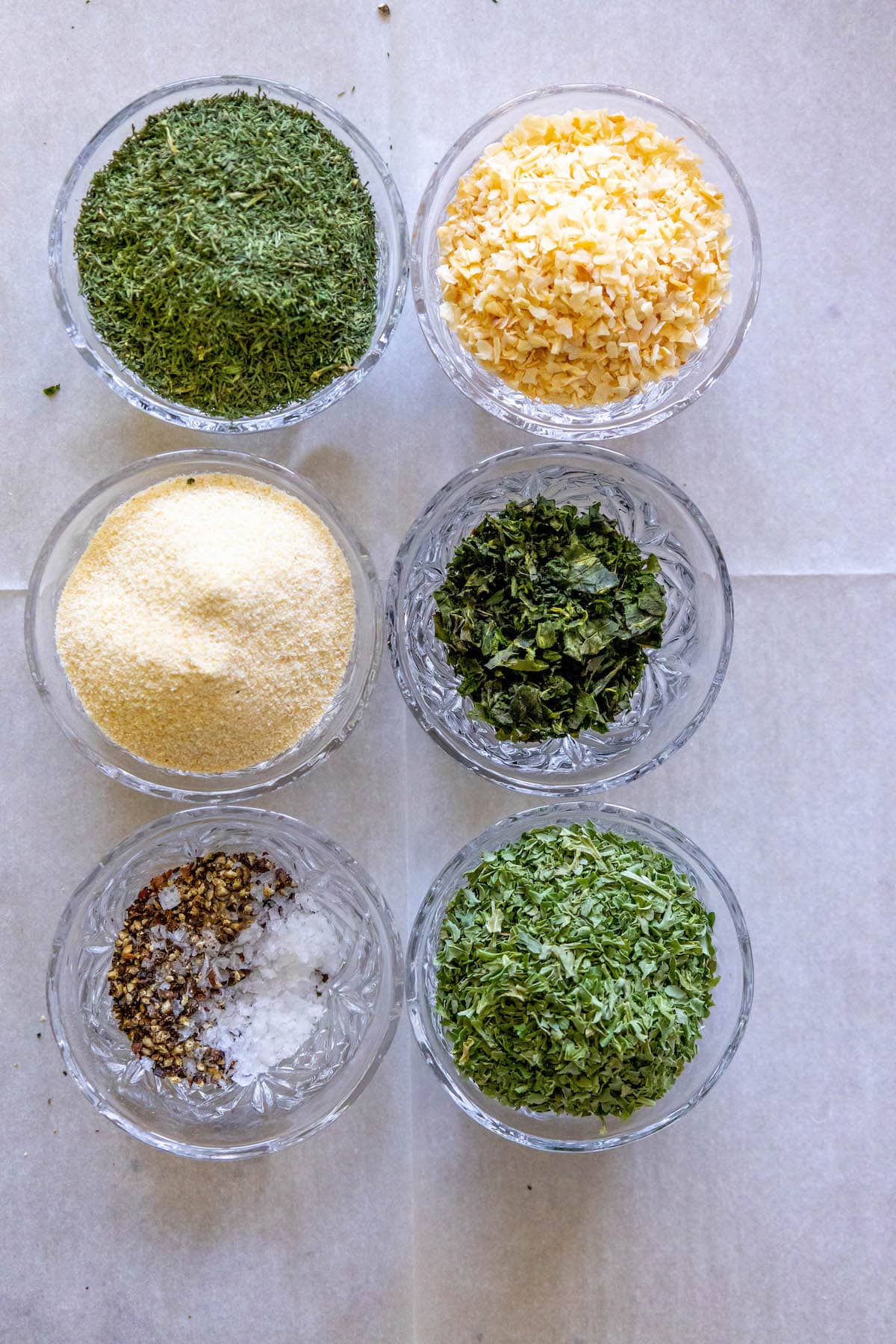 herbs and spices in bowls on a table