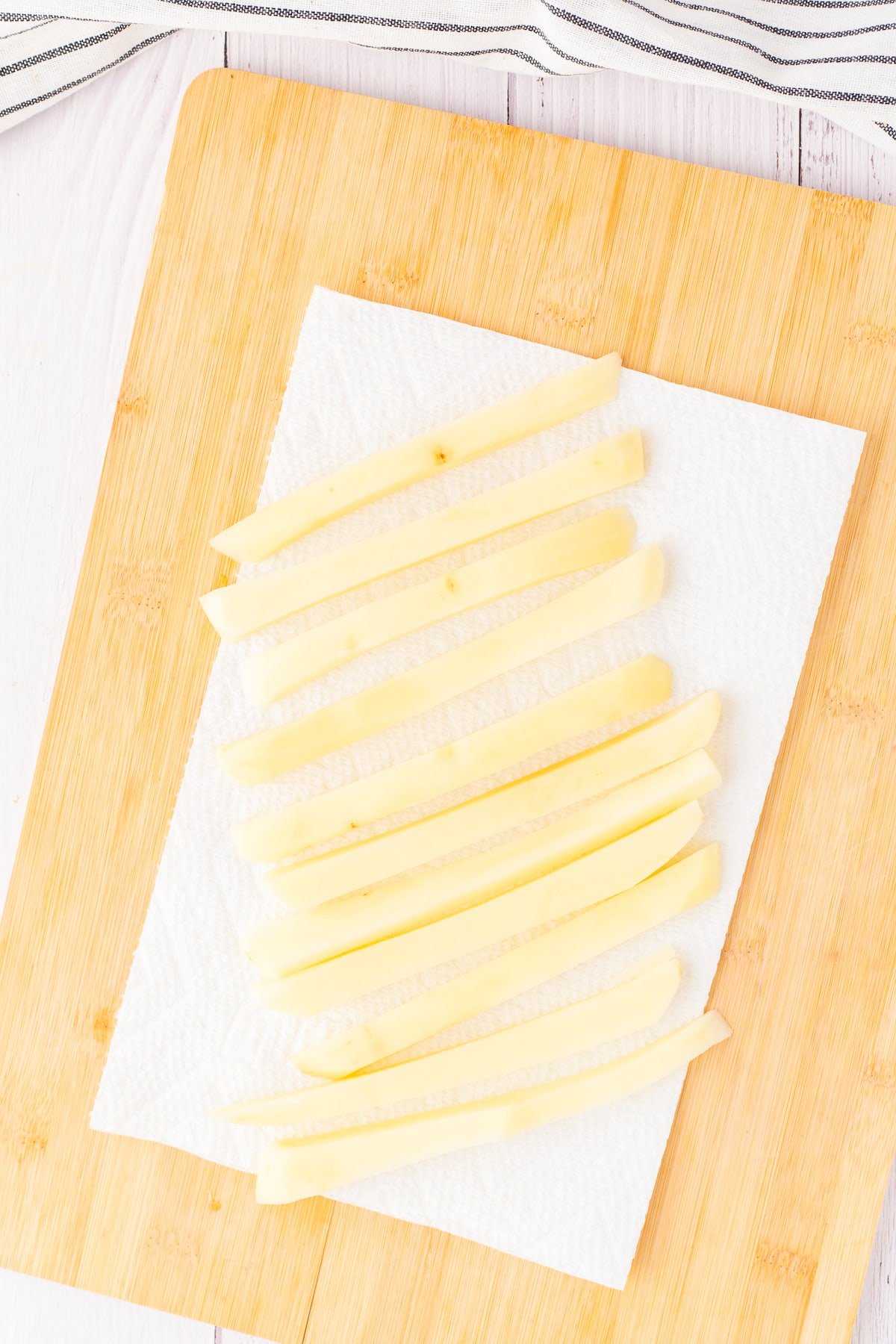 fries drying on a paper towel