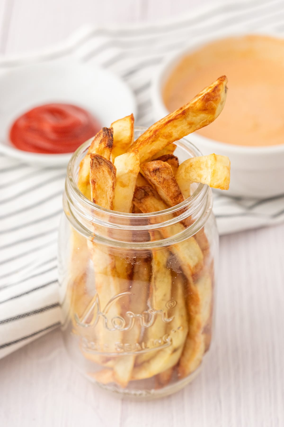 crispy air fried french fries in a jar