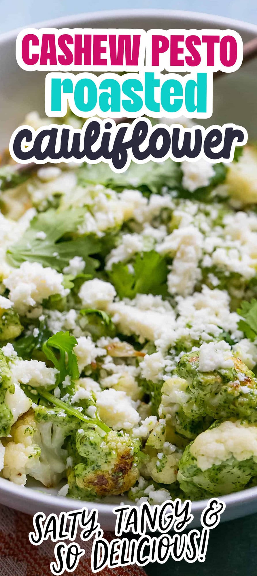 cashew pesto covered cauliflower in a white bowl