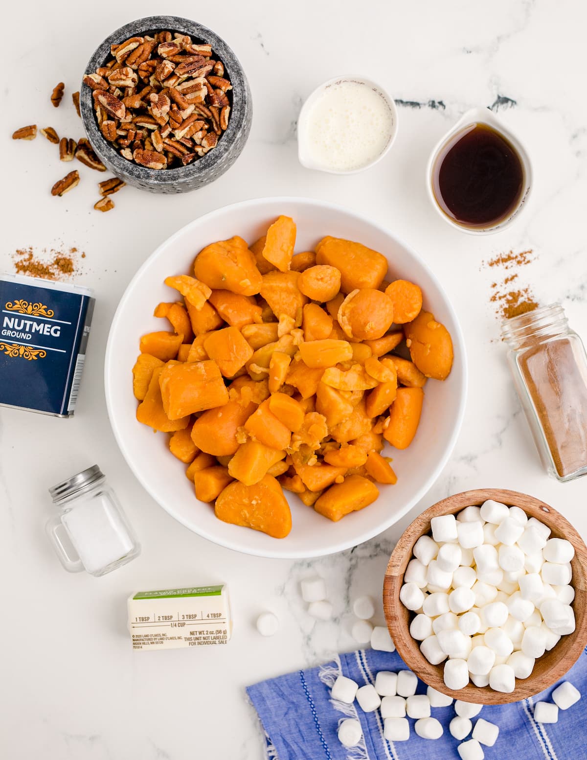 sweet potatoes, marshmallows, vanilla, salt, butter, pecans, laid out