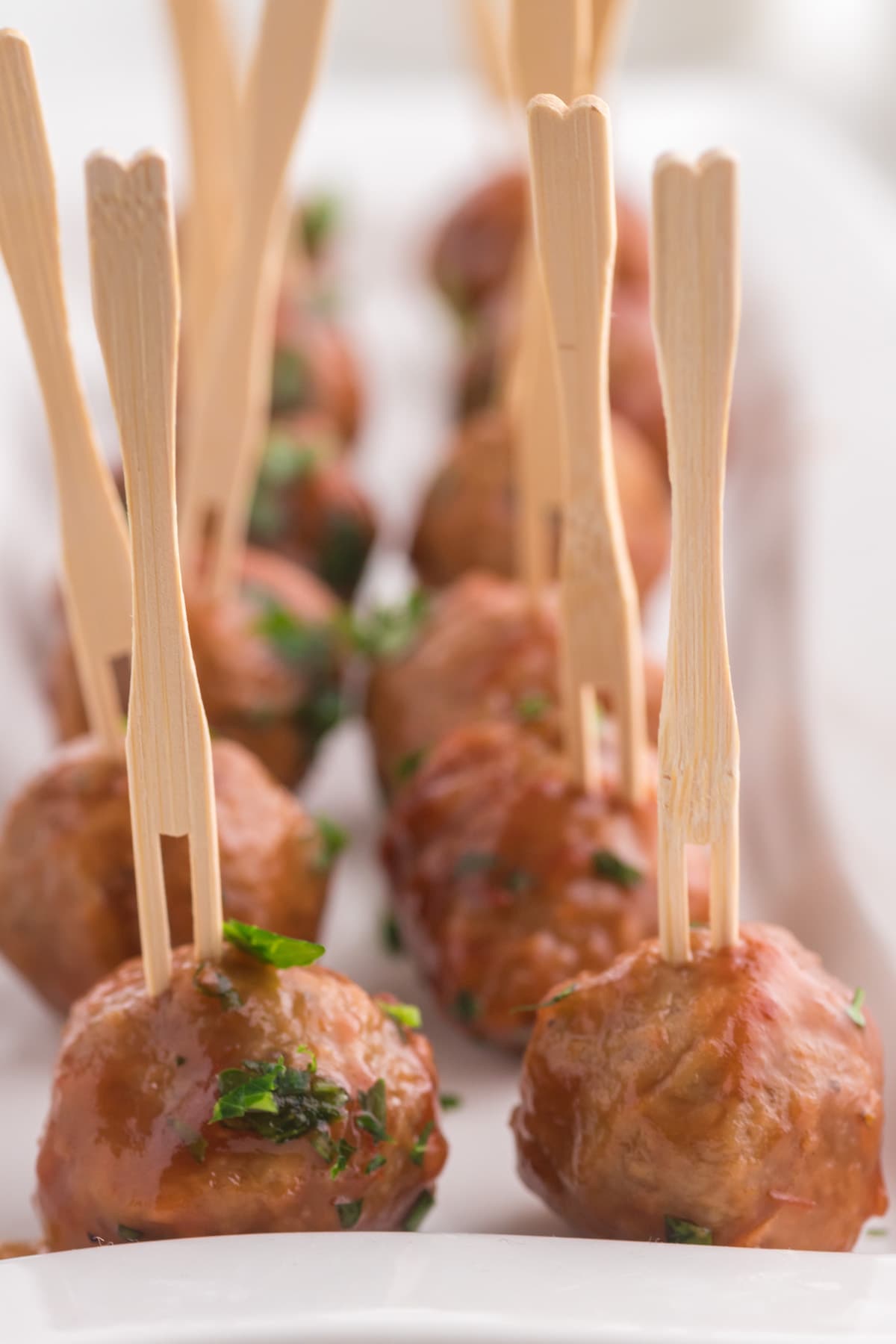 cranberry sauce meatballs with a toothpick in them