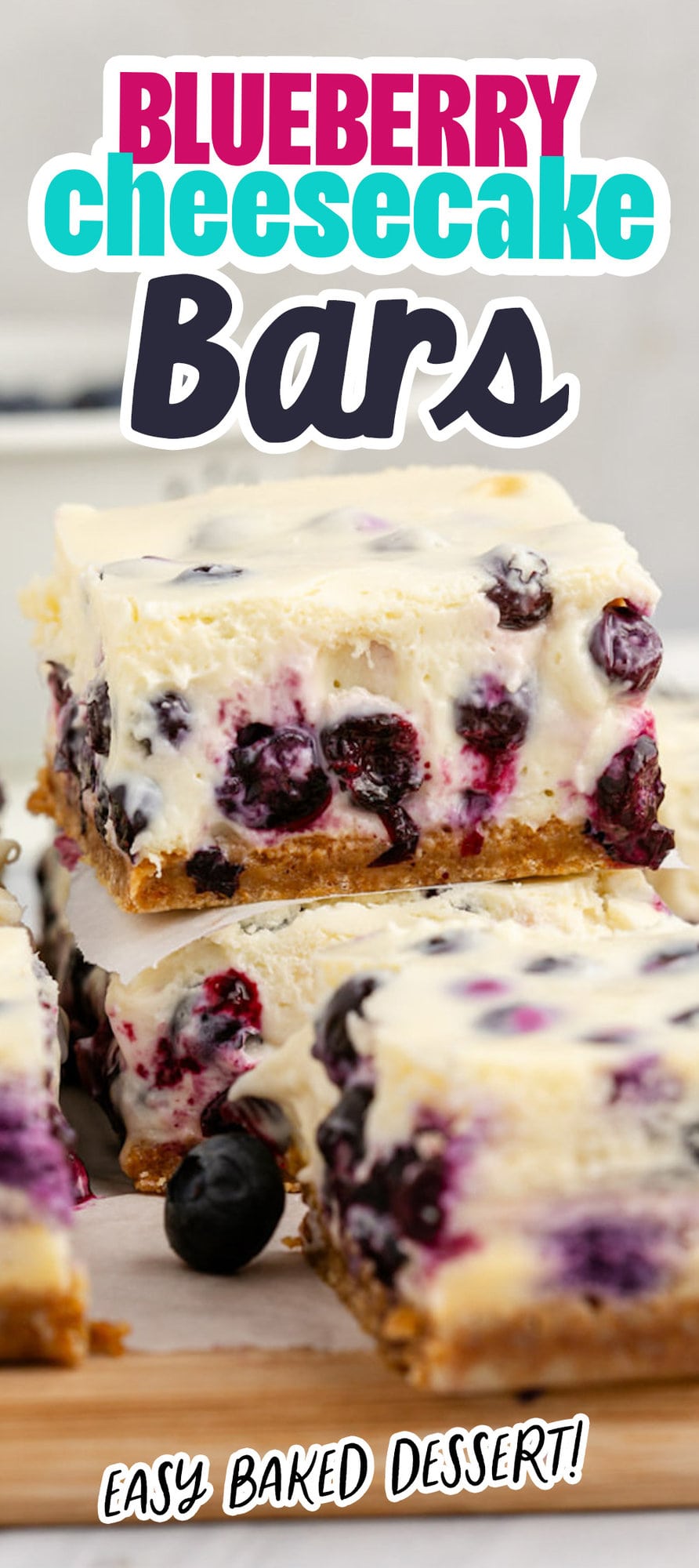 blueberry cheesecake bars stacked on a table