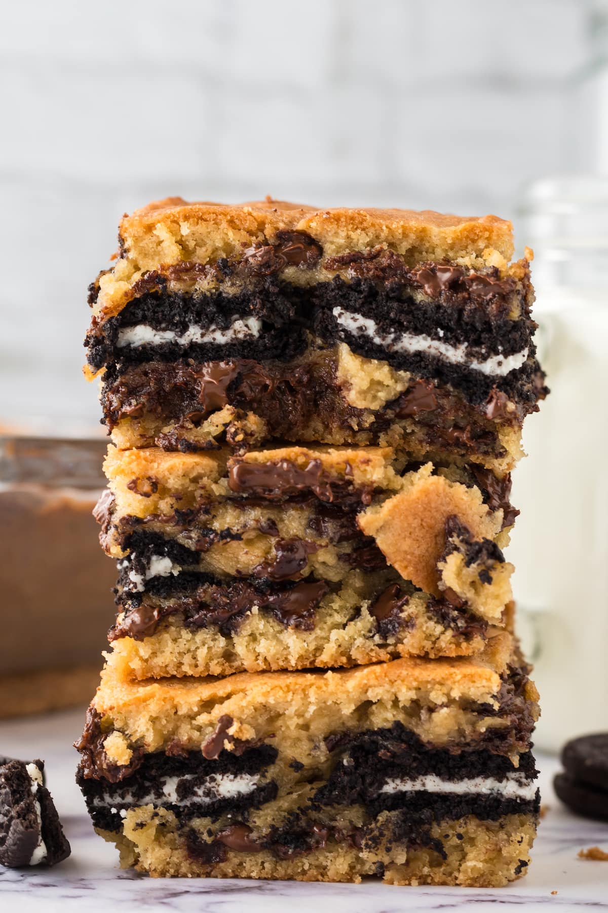 cookie bars stuffed with oreos stacked on top of each other on a table