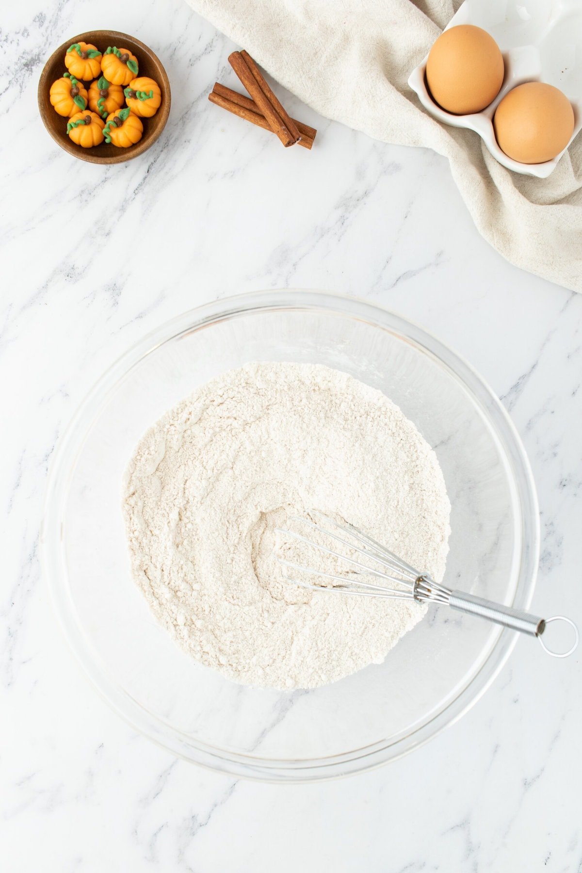 A bowl with ingredients for easy, homemade pumpkin cupcakes.