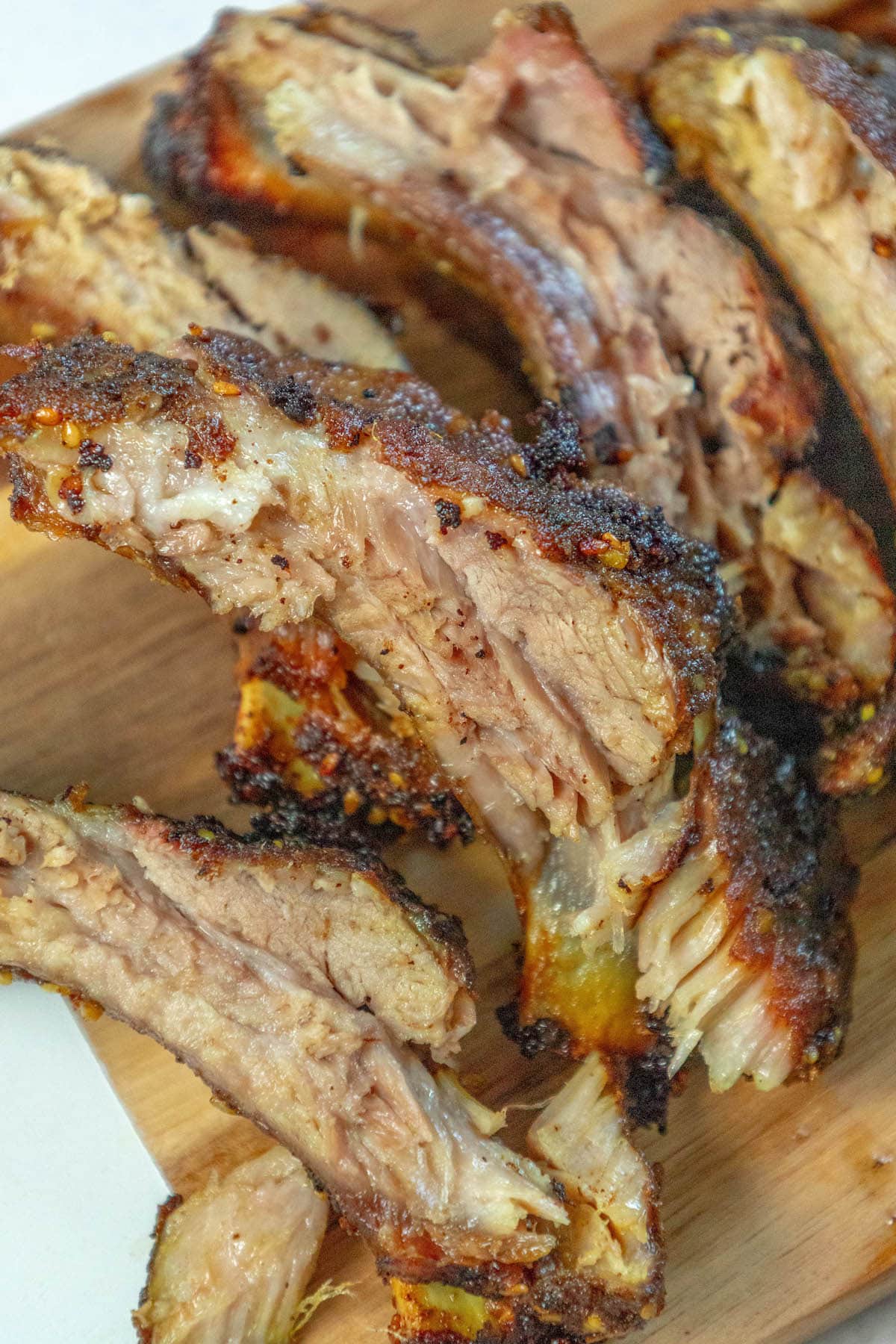 baked ribs in shawarma rub on a cutting board