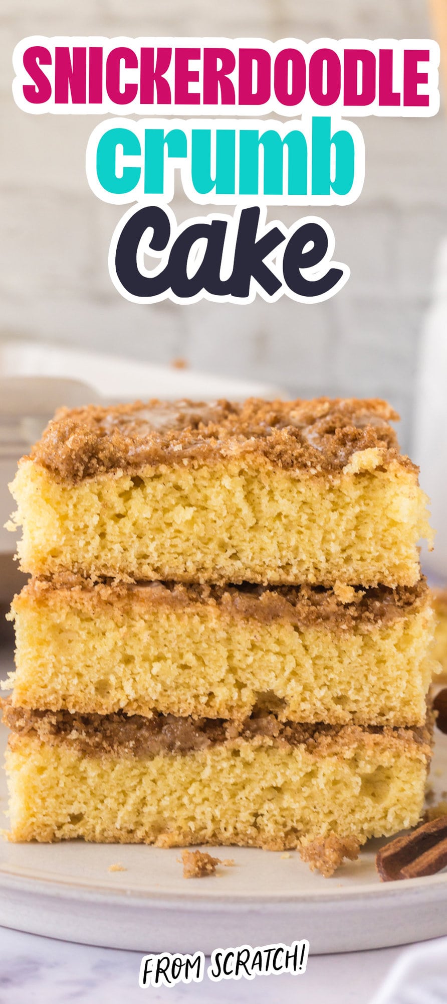 a slice of snickerdoodle crumb cake stacked on top of other slices of cake