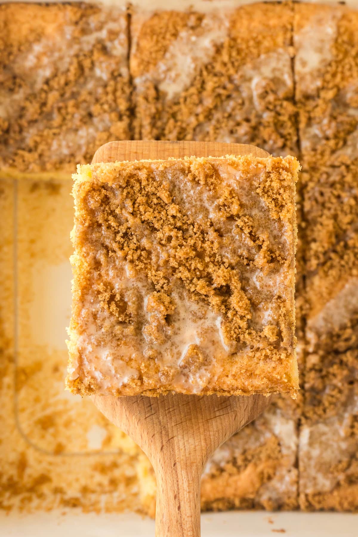 a slice of snickerdoodle crumb cake on a spatula