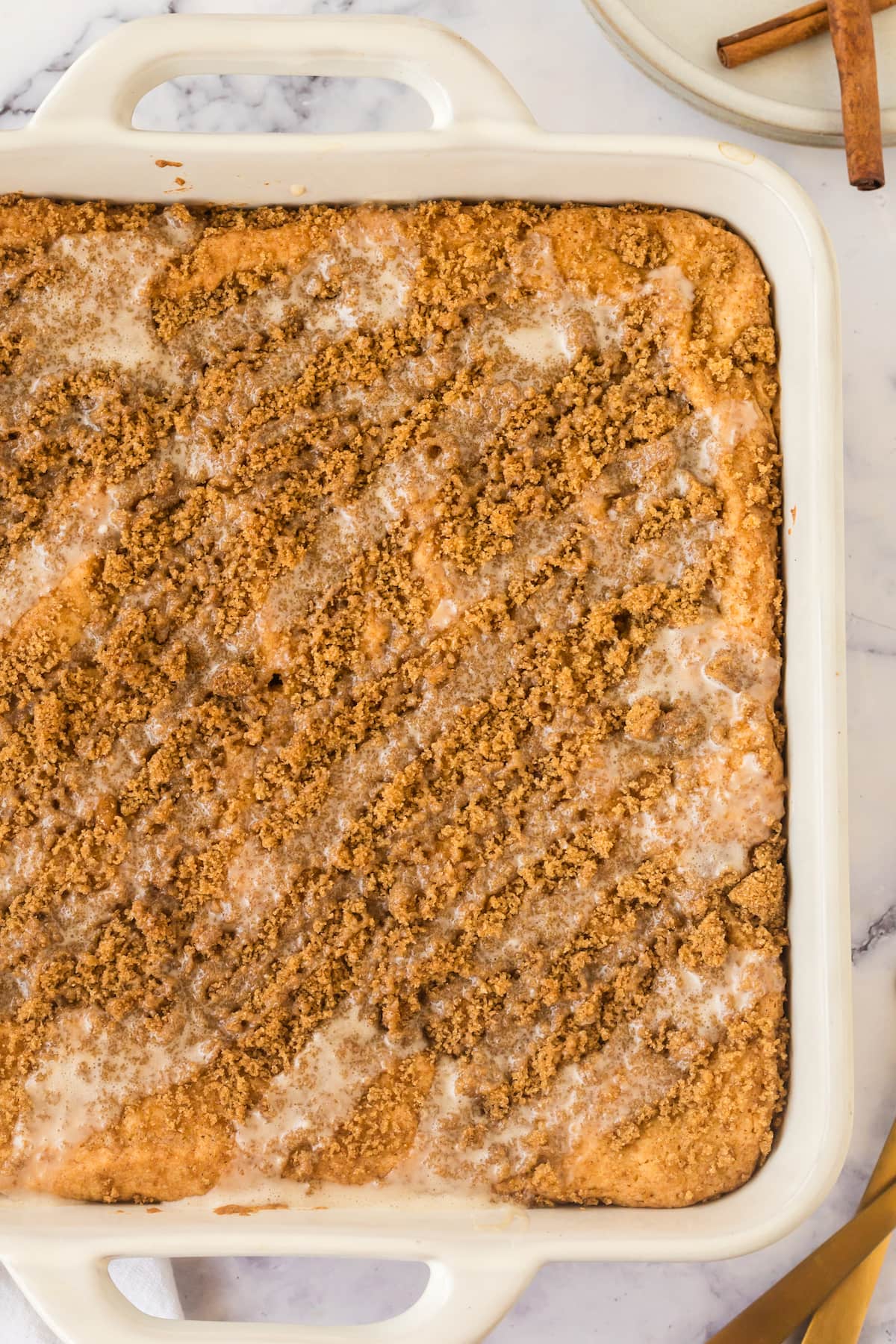 a slice of snickerdoodle crumb cake in a dish