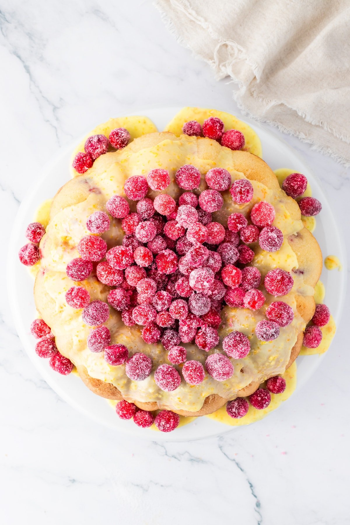 cranberries covered in sugar on a cake