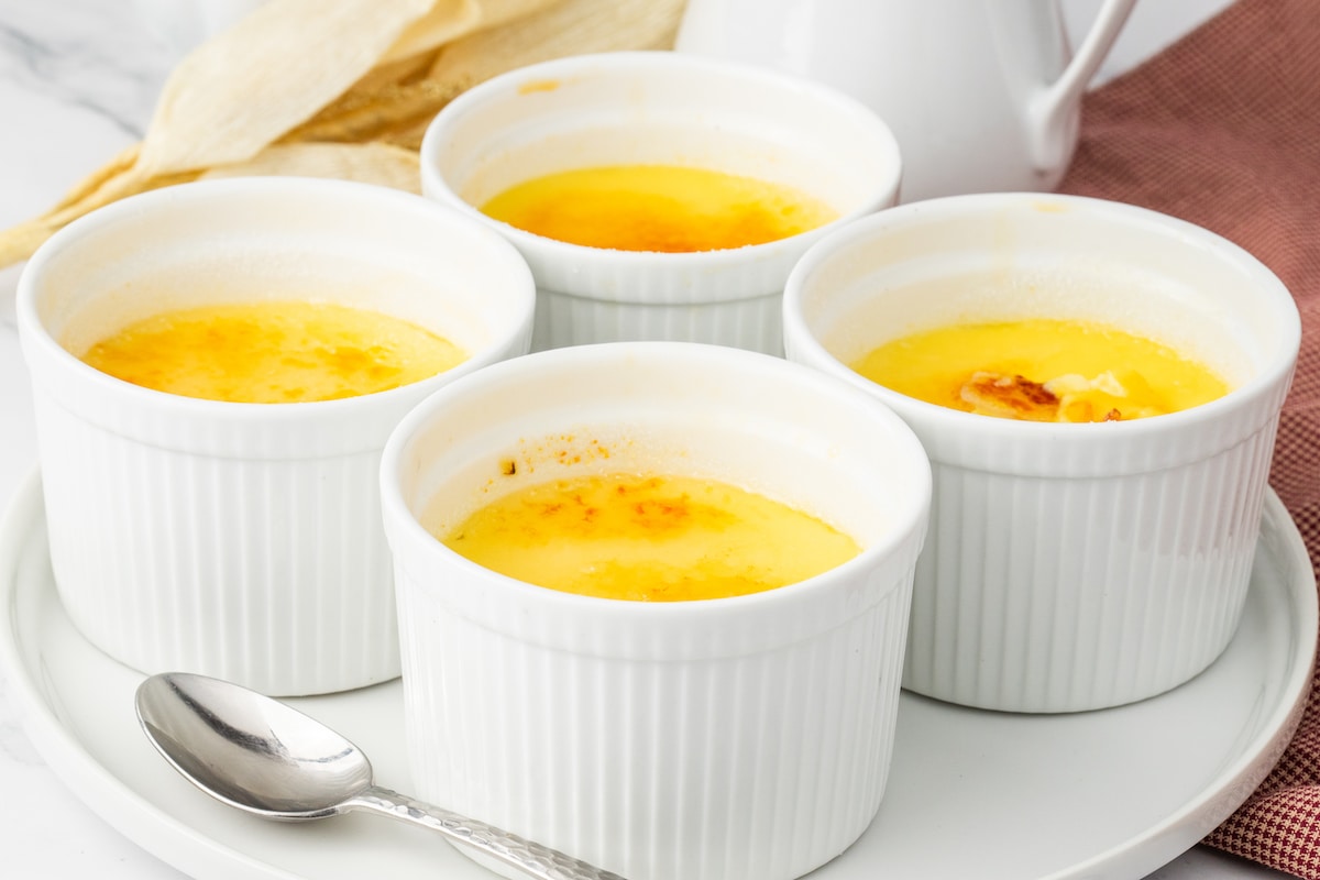 Creme Brûlée in small white ramekins with burnt sugar topping