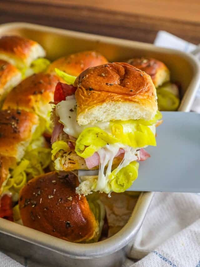 Ham and cheese sliders in a pan.