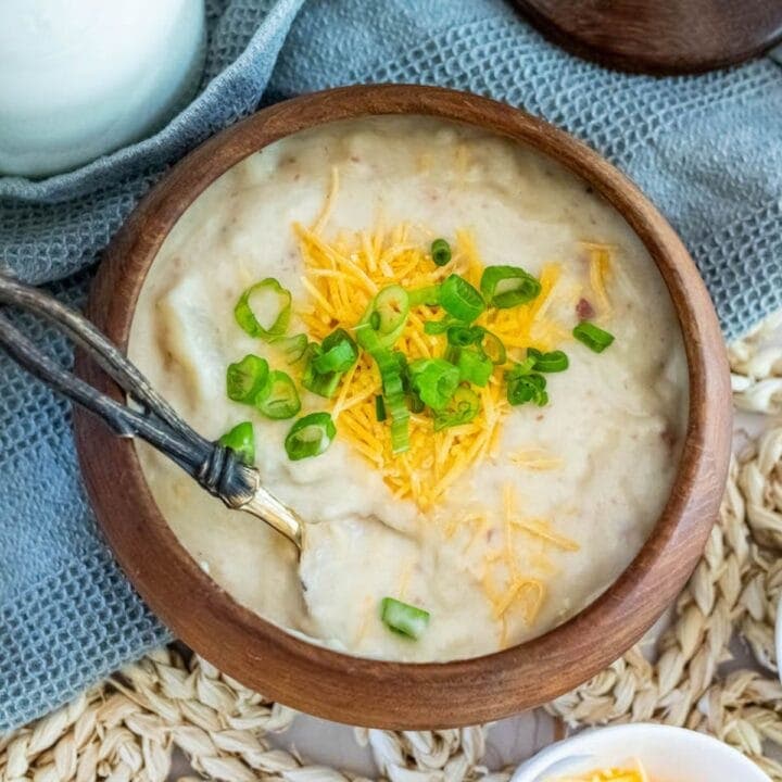 potato soup with a spoon in it