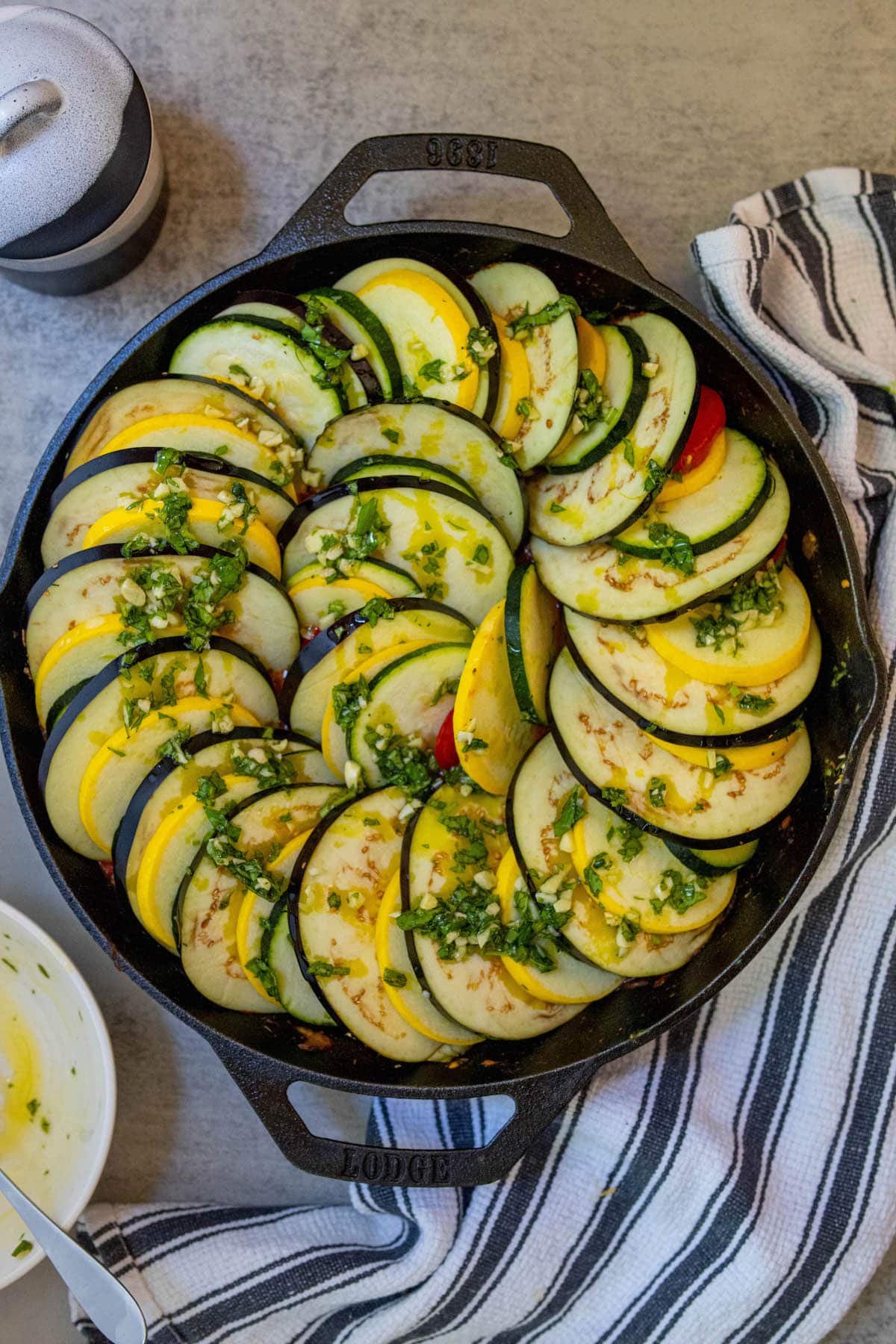 squash and eggplant layered over sautéed tomatoes