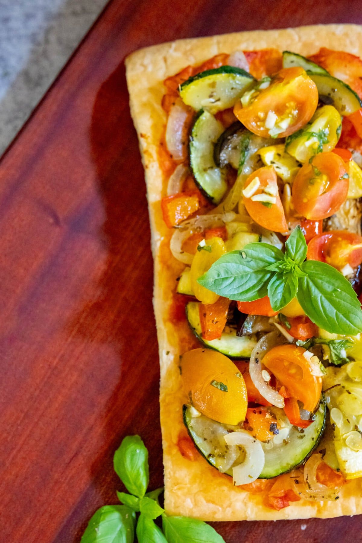 baked tarts with ratatouille on top on a table