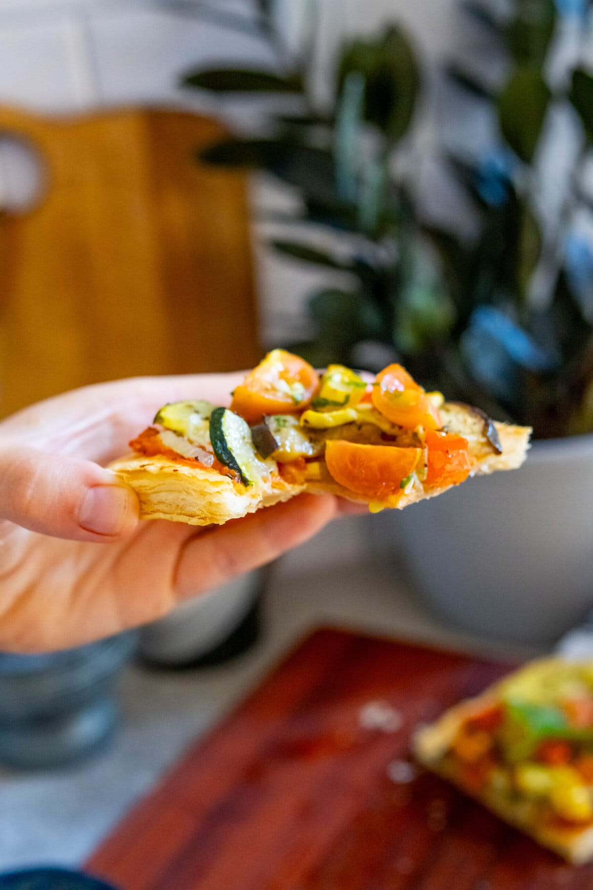 baked tarts with ratatouille  in a hand