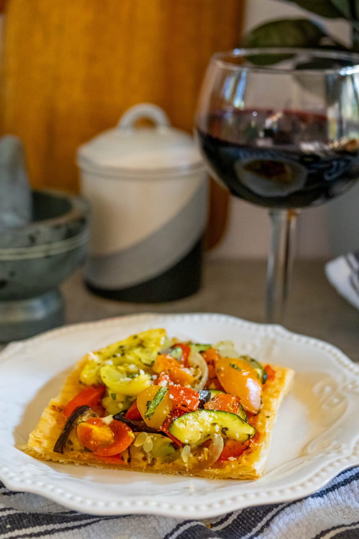 baked tarts with ratatouille on top on a table