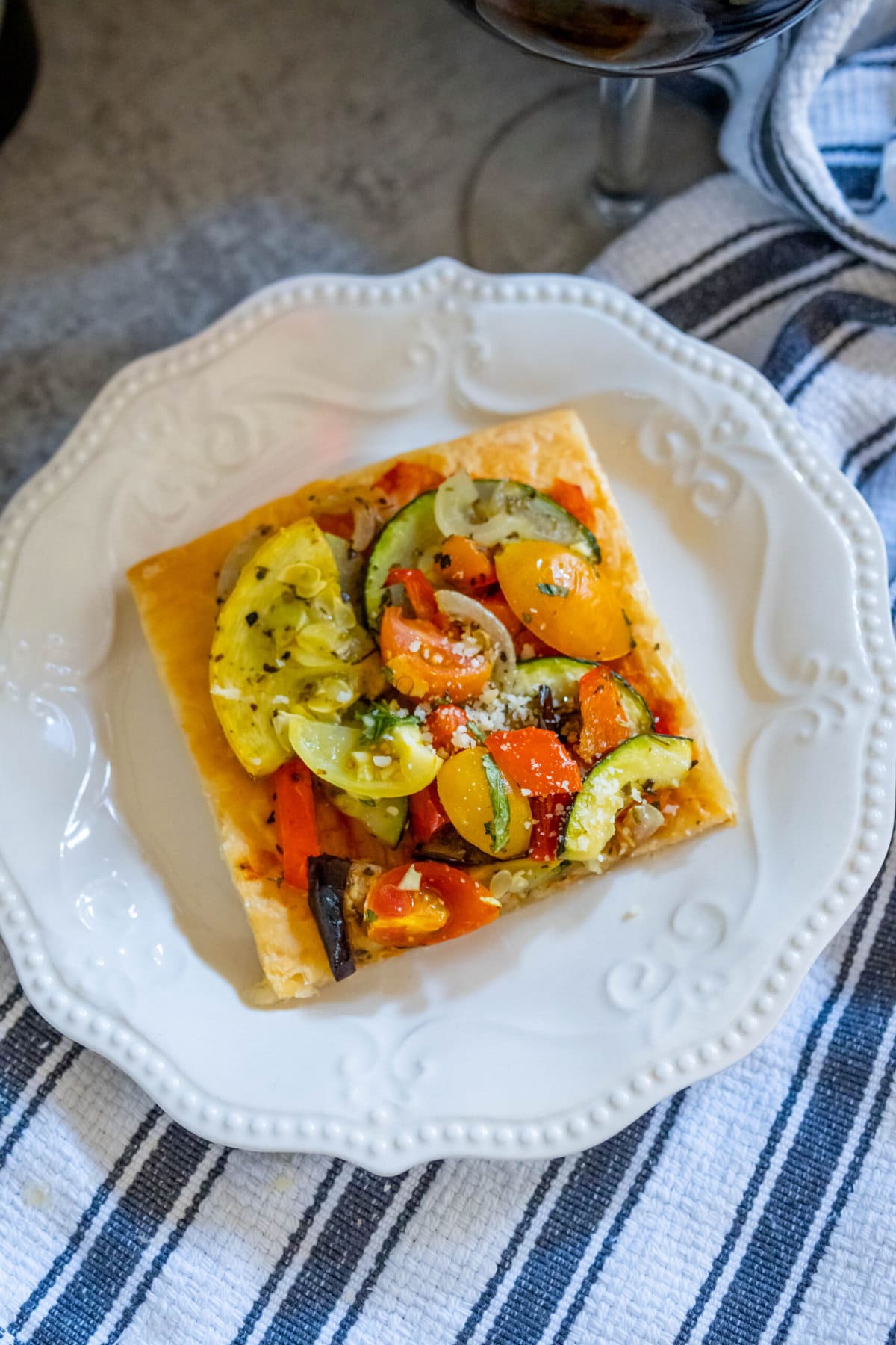 baked tarts with ratatouille on top on a table