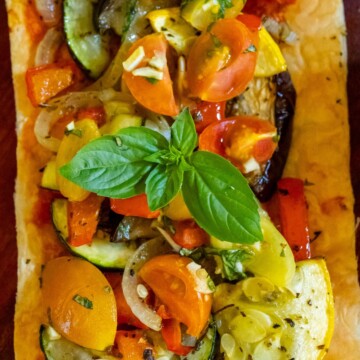 baked tarts with ratatouille on top on a table