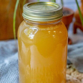 Honey and slow cooker on a table.