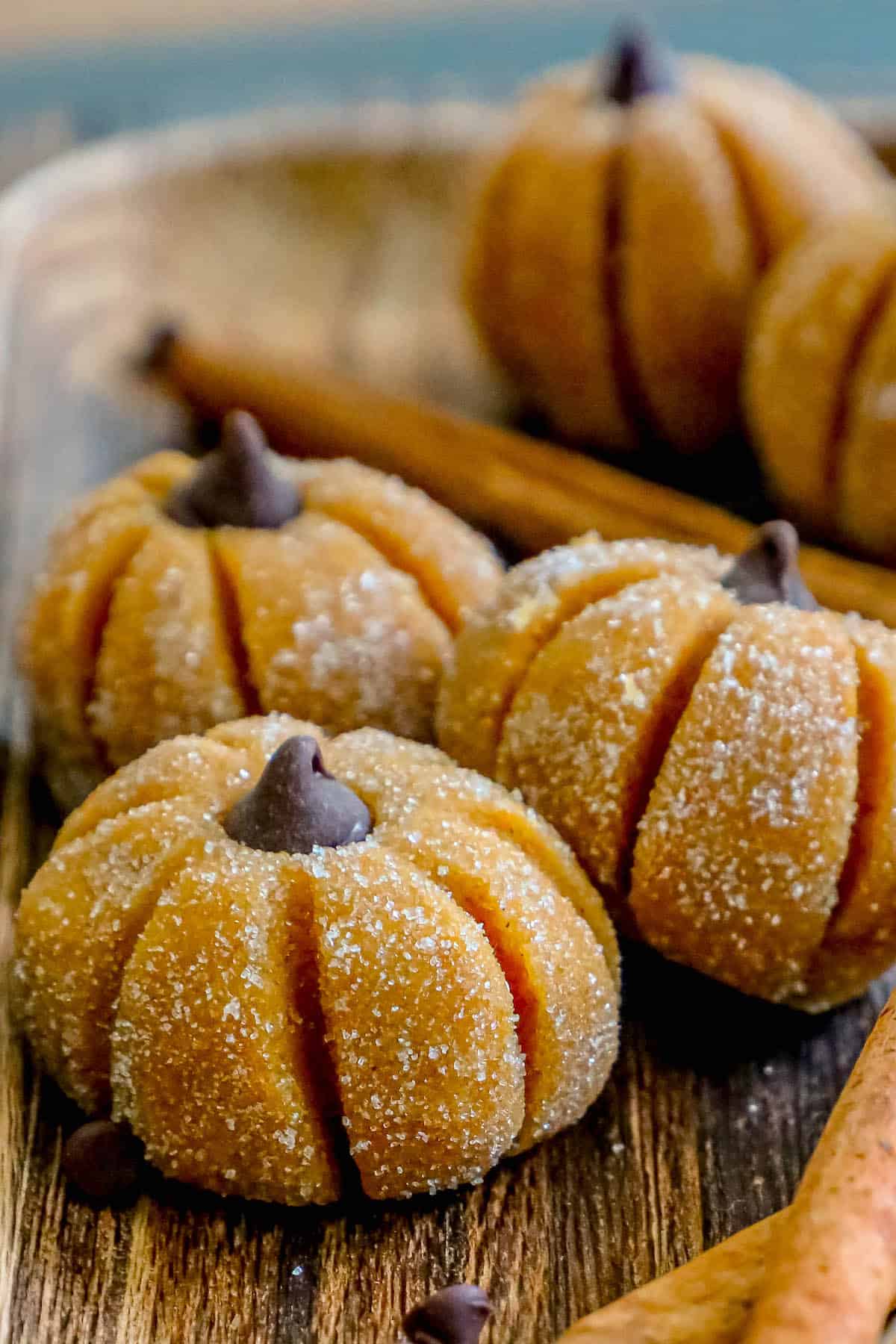 Pumpkin cookies on a wooden board.