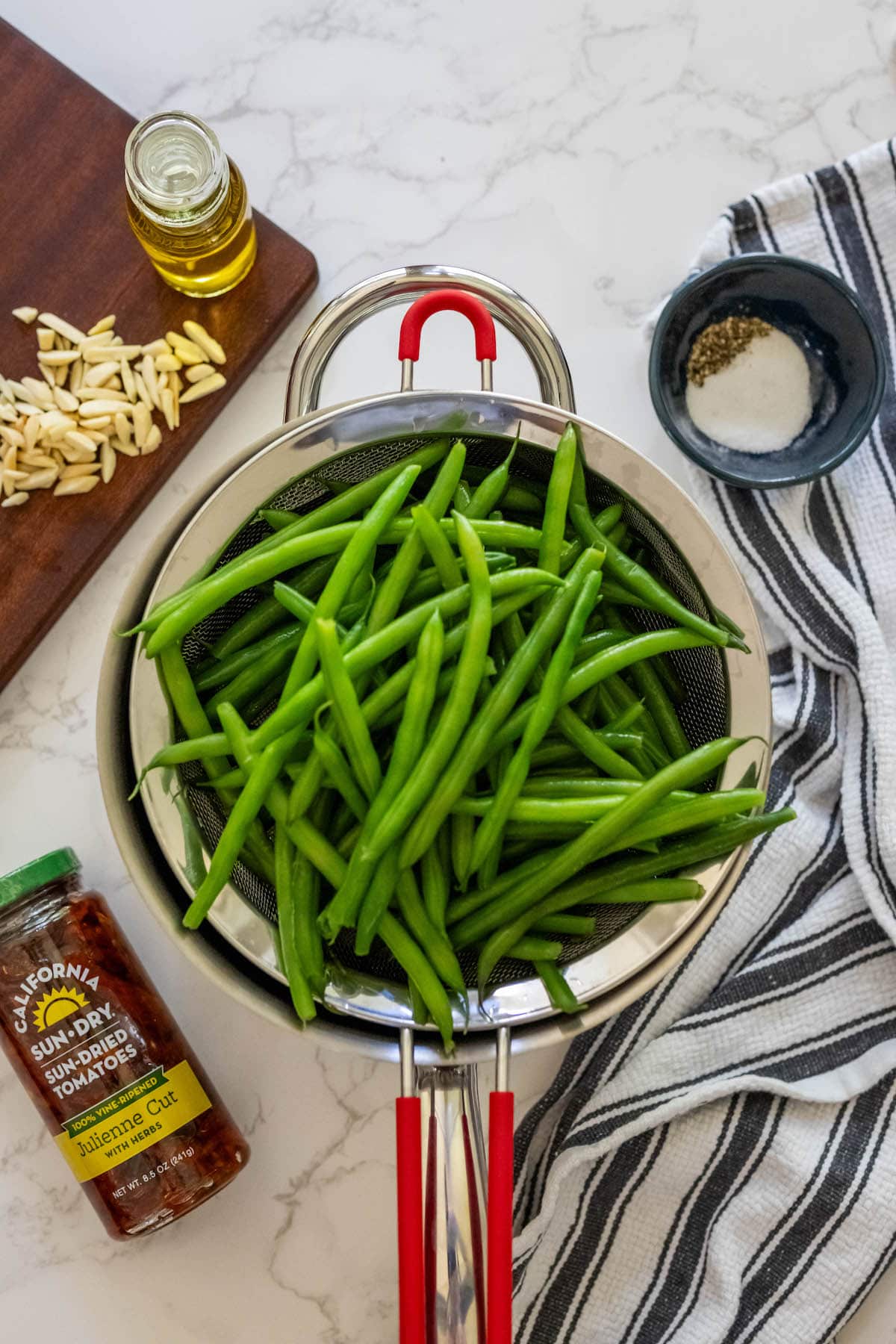 Cheesy baked green beans on a counter.