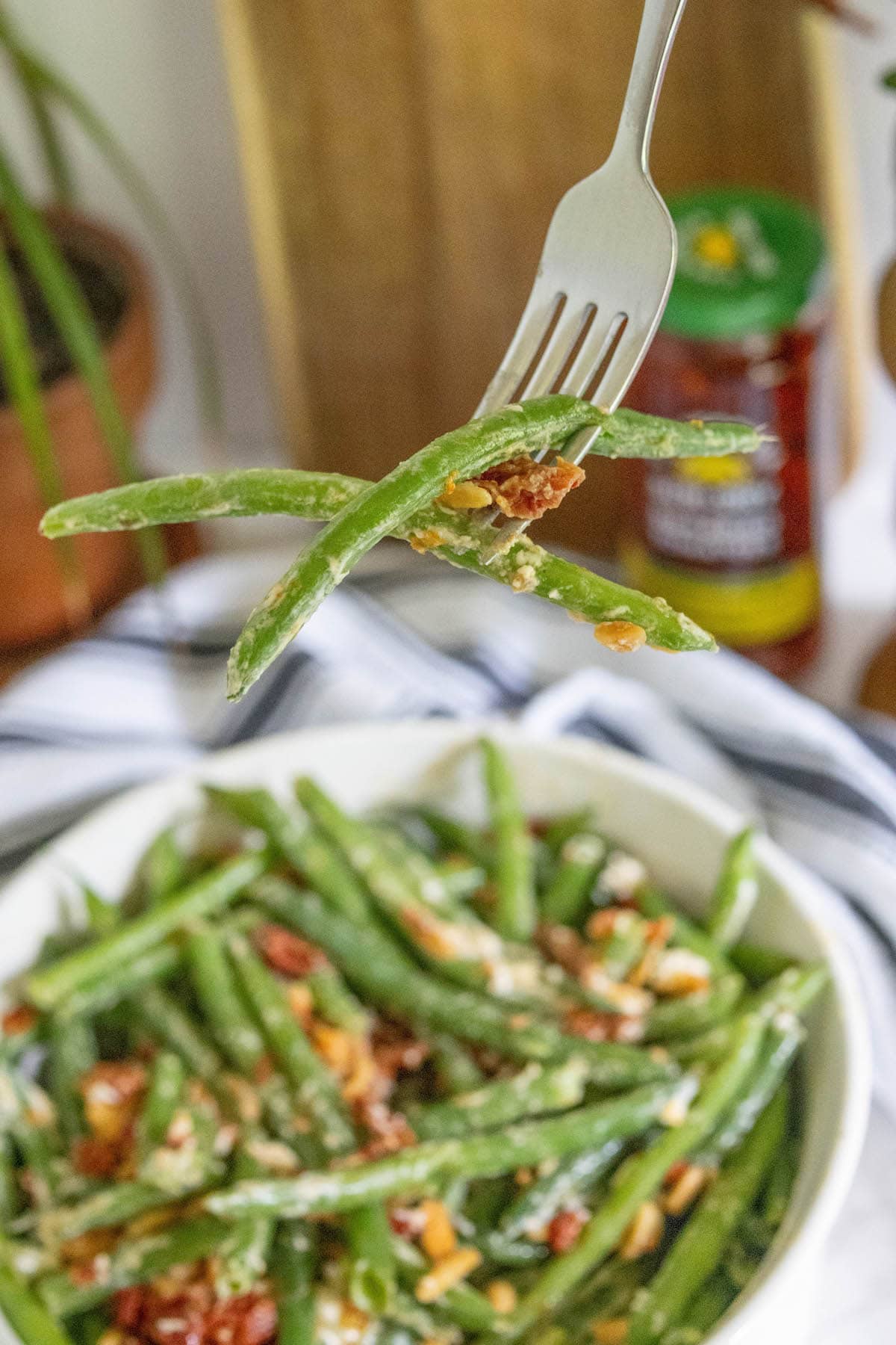 Green beans in a white bowl.