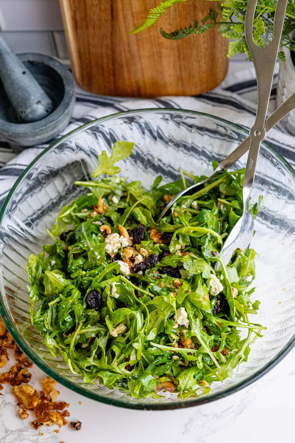 Arugula salad with walnuts, dry fruit, and cheese