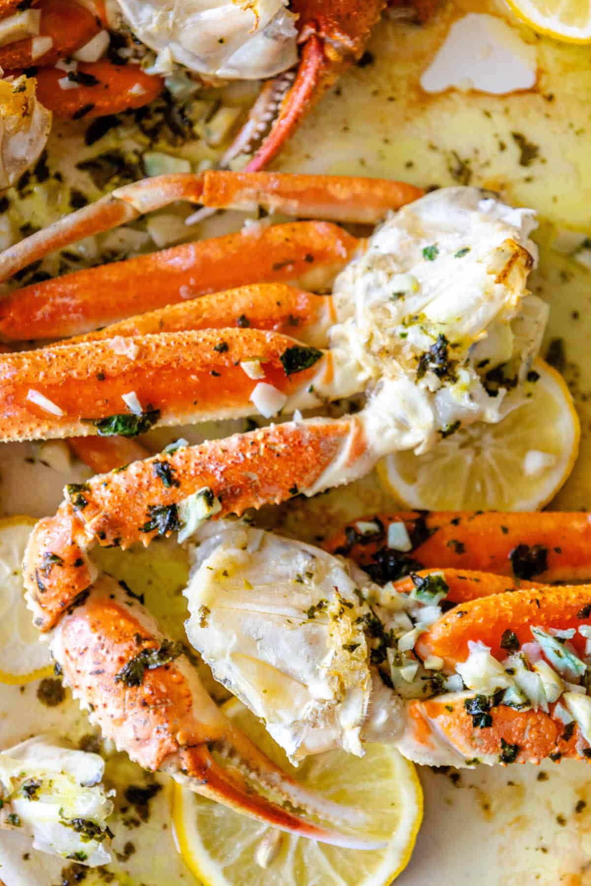 Baked Snow Crab Legs with lemon and herbs.