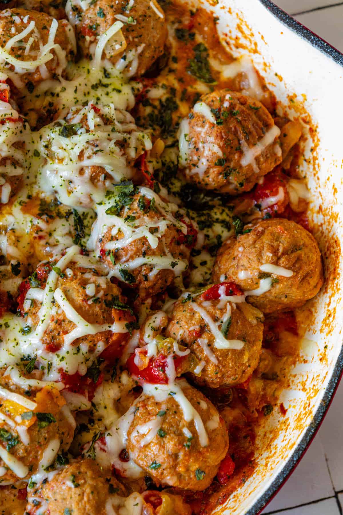 A Cheesy Italian Meatball Skillet filled with vegetables.