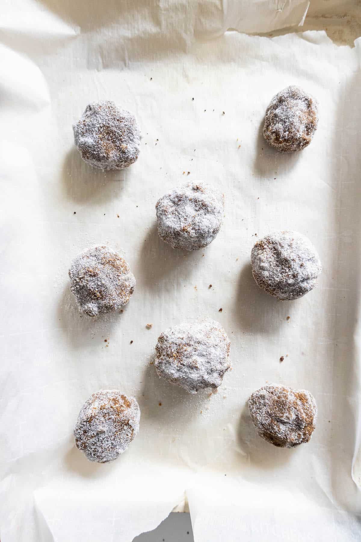 Powdered sugar cookies on a baking sheet, old fashioned molasses cookies.