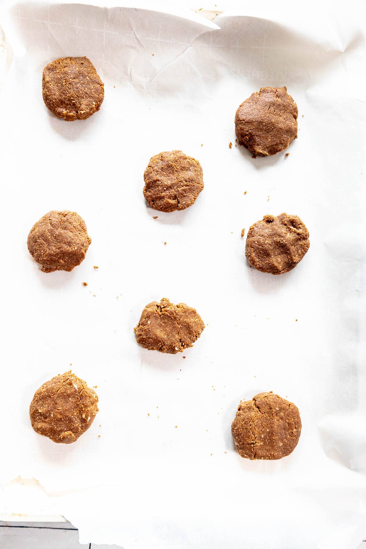 Chewy molasses cookies on a baking sheet.