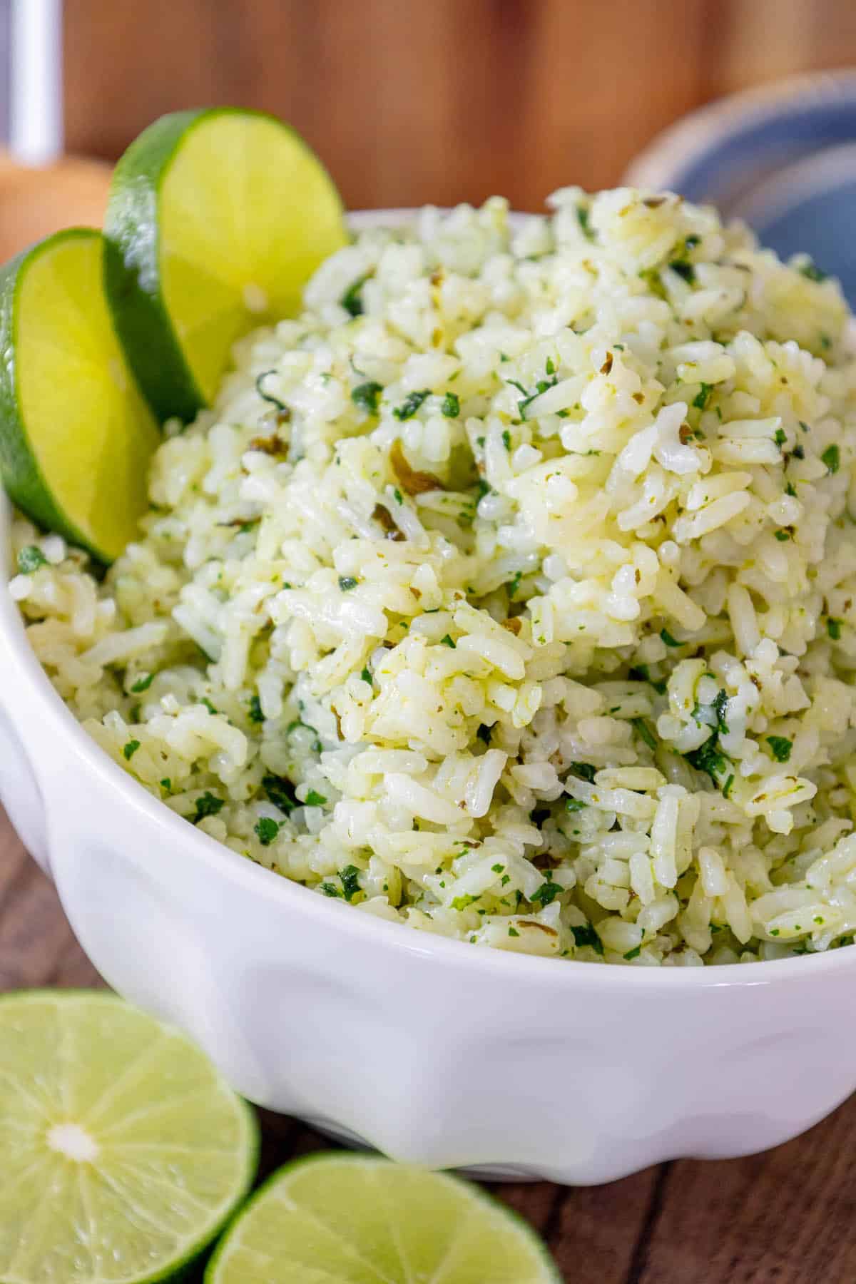 Lime rice in a white bowl with lime slices, Chipotle Knockoff.