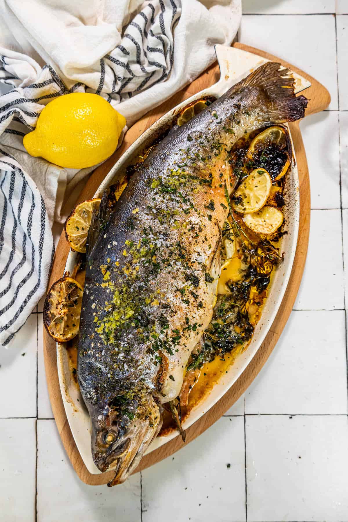 Herb-stuffed fish with lemons and herbs.