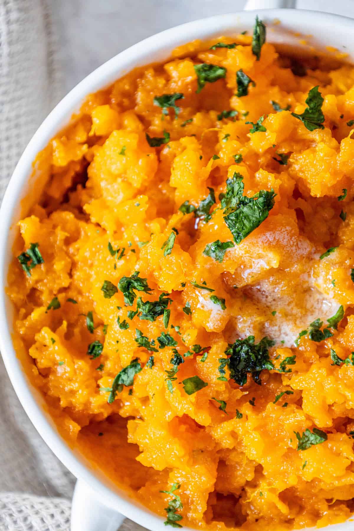 Mashed sweet potatoes with parsley.