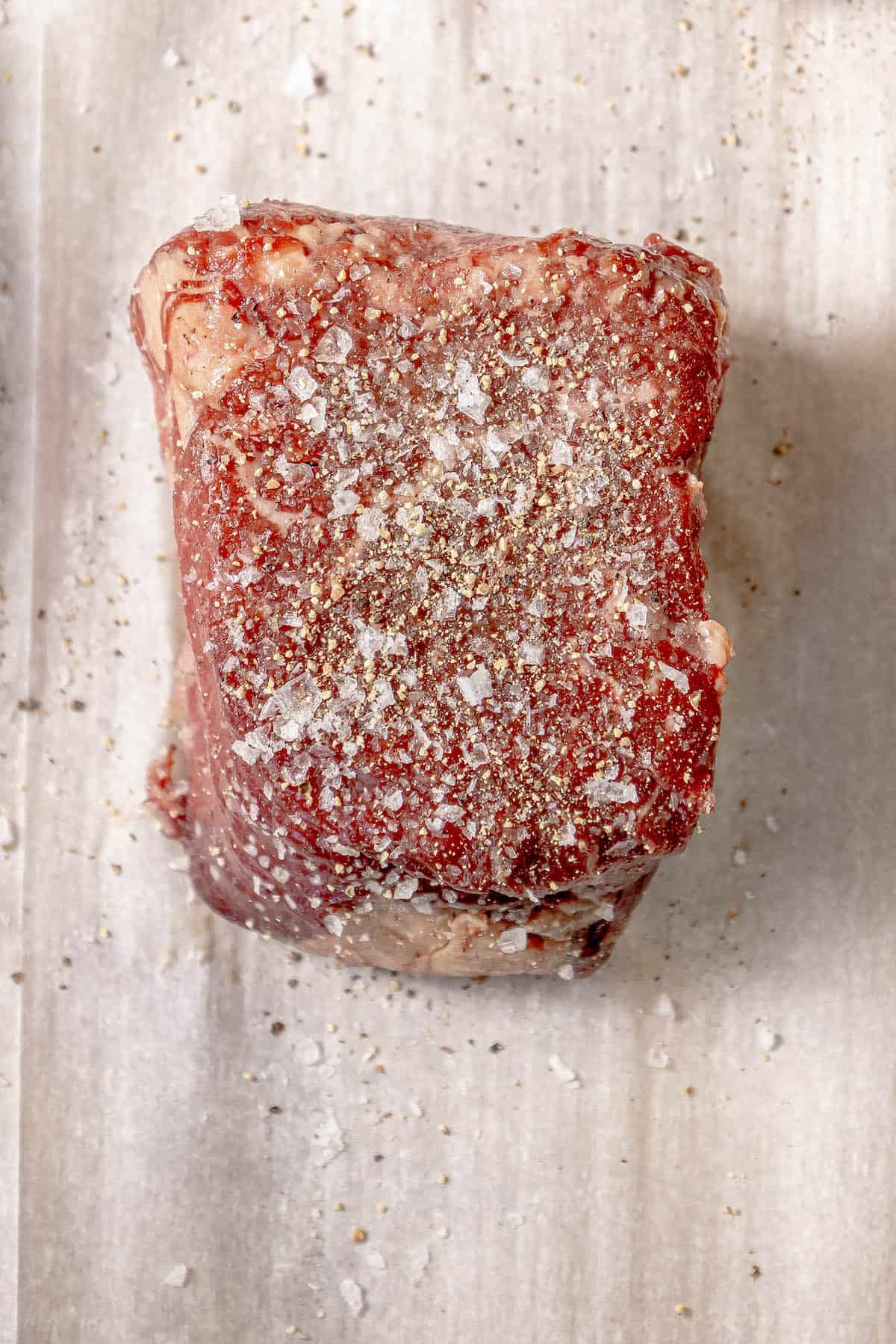 A Reverse Sear Filet Mignon is sitting on top of a piece of paper.