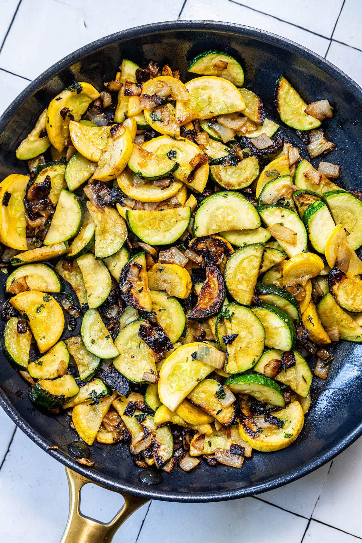 Easy sautéed zucchini and mushrooms in a skillet, perfect as a side dish.